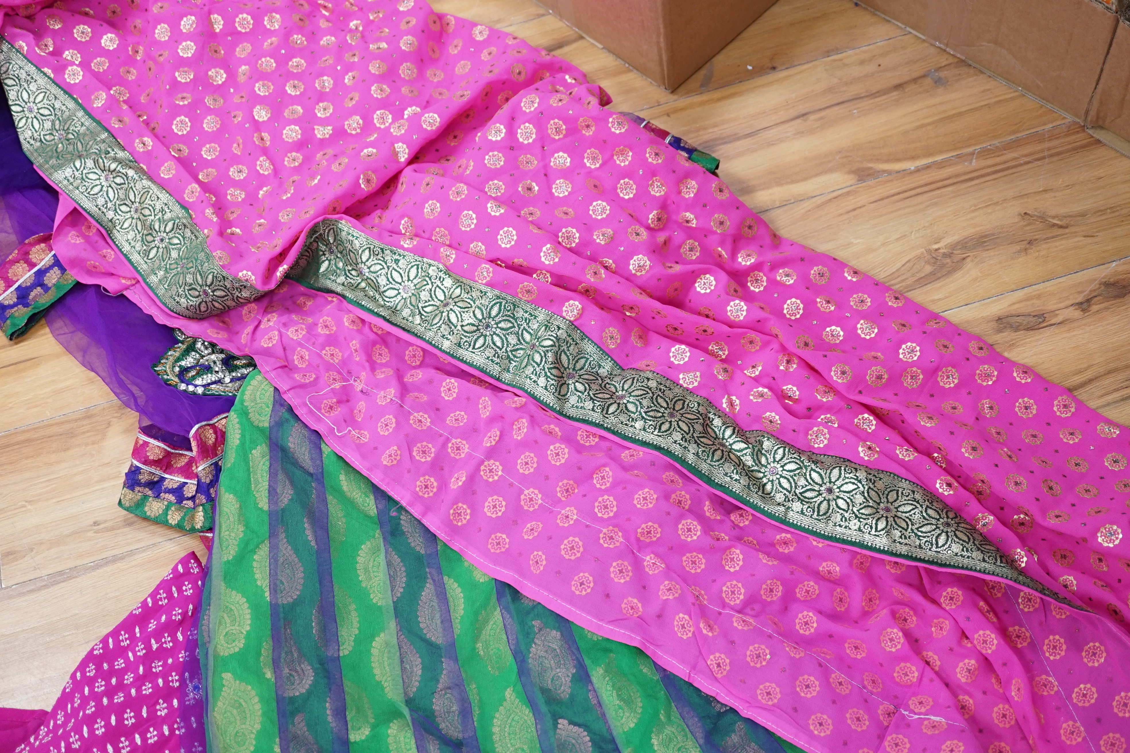 A collection of Indian silk saris and costume possibly bridal